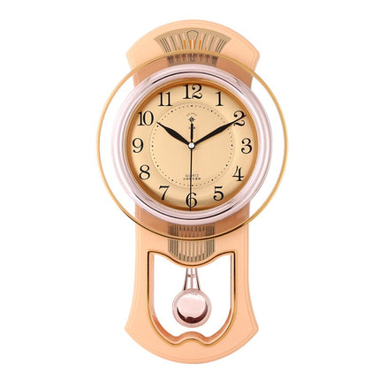 Goudkleurige vintage wandklok met slinger