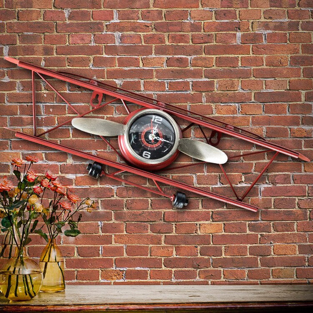 Vintage wandklok in vorm van vliegtuig