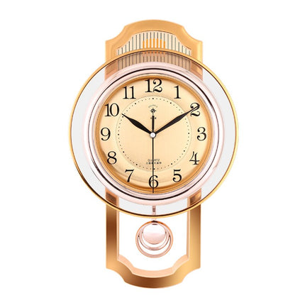 Goudkleurige vintage wandklok met slinger