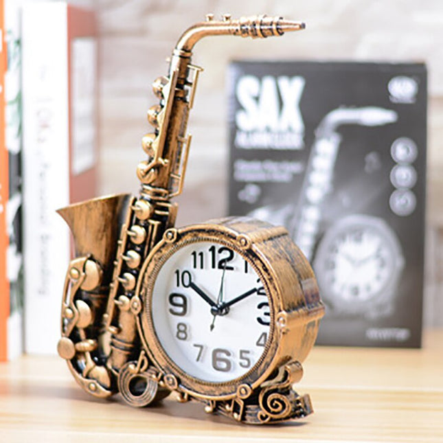 Vintage tafelklok in saxofoon vorm