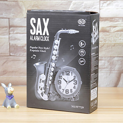 Vintage tafelklok in saxofoon vorm