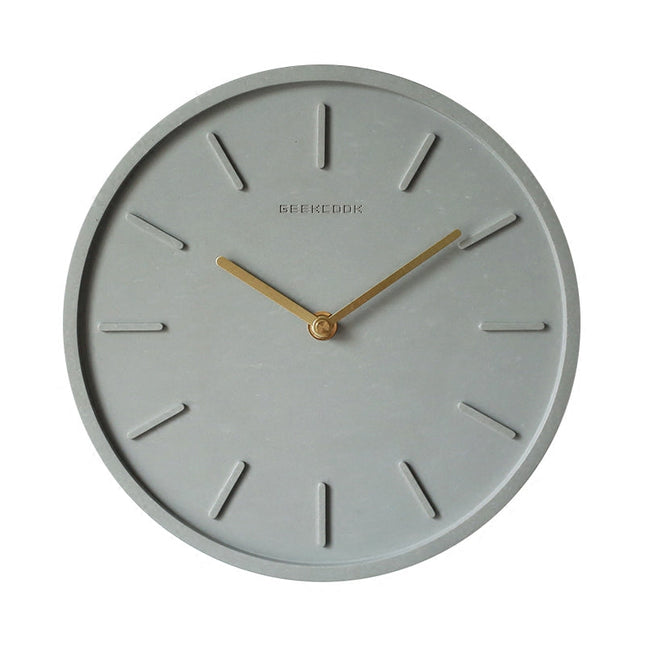 Minimalistische wandklok van grijs betonlook