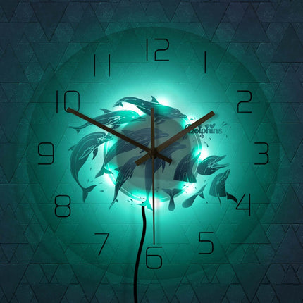 Mooie wandklok met springende dolfijnen