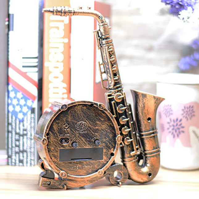 Vintage tafelklok in saxofoon vorm