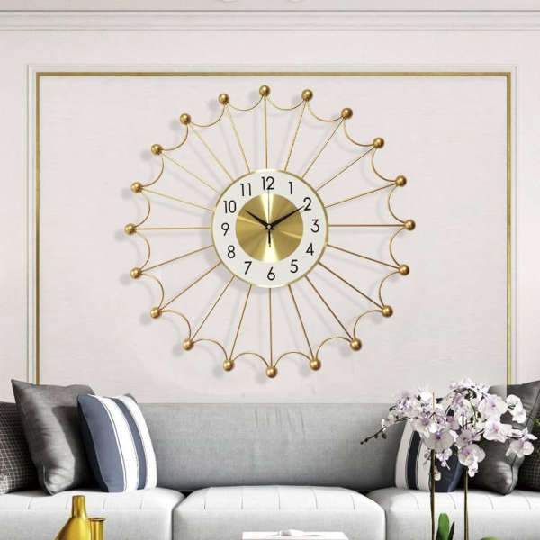 Grote gouden design wandklok zon